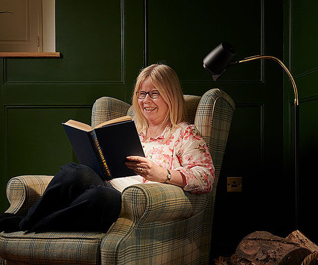 Woman reading with HD floor light