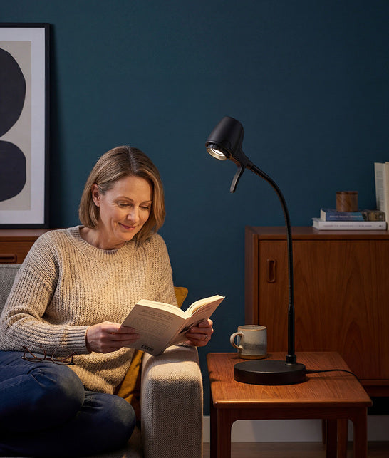 Woman reading with HD Pro table light