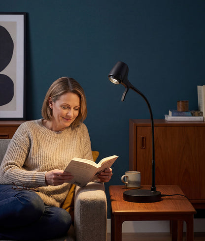Woman reading with HD Pro table light