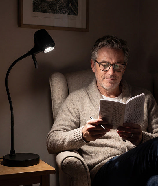 Man reading with HD Pro table light