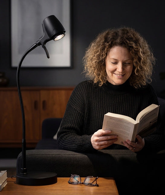 Woman reading with HD Pro table light