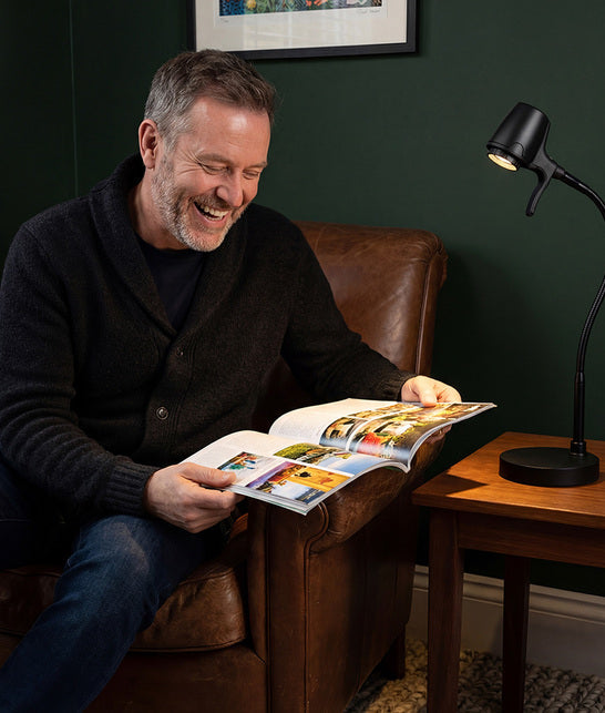 Man reading with HD Pro table light