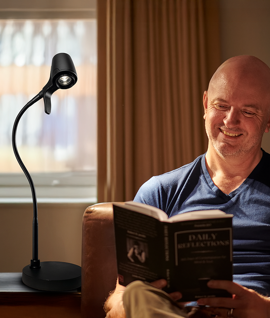 Man reading with HD table light