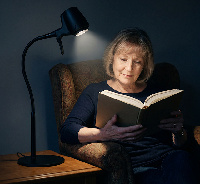 Woman reading with HD Original table light