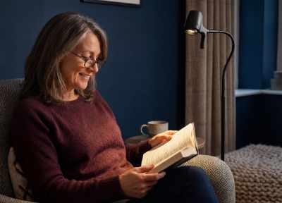 Woman reading with a HD Pro Floor Light