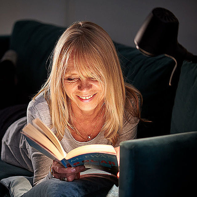 Woman reading with HD floor light