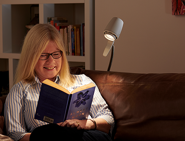 Woman reading with HD floor light