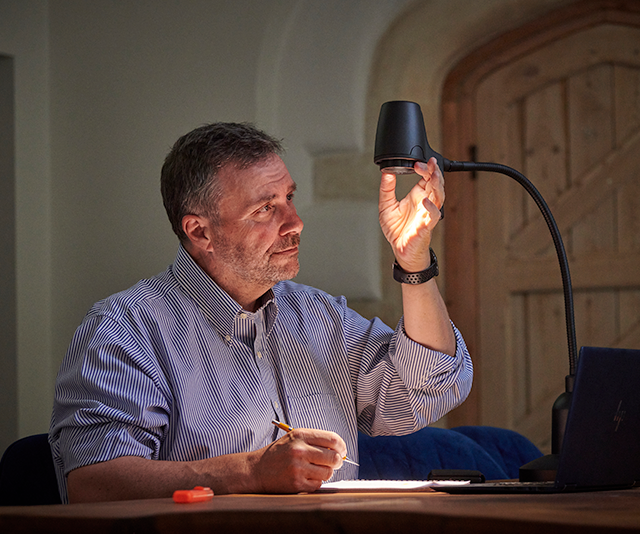 Man reading with HD Original table light
